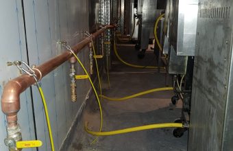 Commercial kitchen gas pipework with quick-release bayonet hoses installed by a Gas Safe catering engineer in London